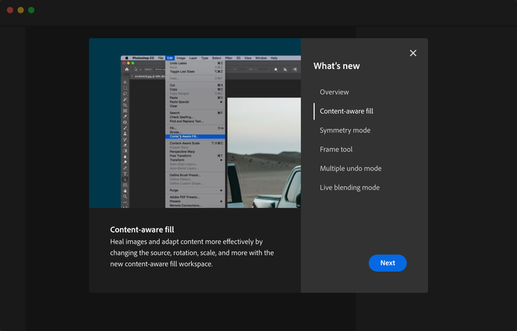 Example of a modal showing new features in Photoshop CC. Title, What’s new. 6 topics, Overview, Content-aware fill, Symmetry mode, Frame tool, Multiple undo mode, Live blending mode. Call-to-action button, label Next. Selected topic, Content-aware fill. Description, Heal images and adapt content more effectively by changing the source, rotation, scale, and more with the new content-aware fill workspace.