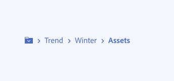 Key example showing correct usage of displaying an appropriate number of breadcrumb items. Truncation menu shown with three breadcrumb items Trend, Winter, Assets.