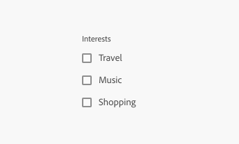 Key example of a checkbox group with a field label. Label, Interests. 3 checkboxes, labels Travel, Music, Shopping.