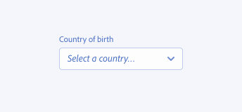 A key example of a picker with correct sentence case capitalization. A picker with the label Country of birth and the placeholder text Select a country followed by ellipsis.