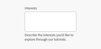 Key example of a text area with help text that has overflowed to a second line. Text area label, Interests. Help text in grey color, Describe the interests you’d like to explore through our tutorials.